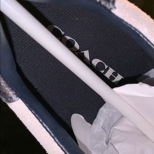 A pair of Coach Shoes